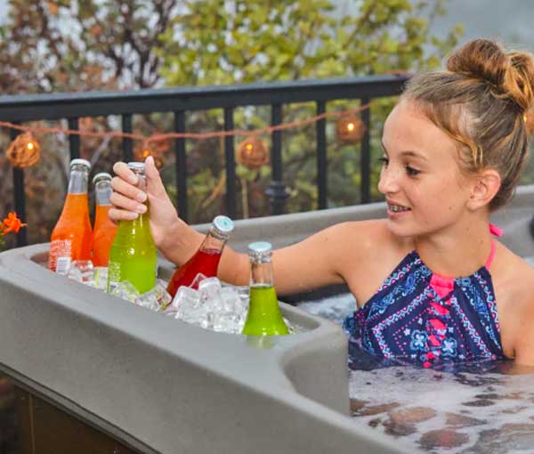 Child grabbing a drink from the Azure Premier Freeflow Spa Ice Bucket