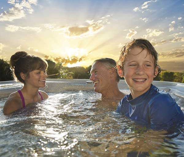 Family spending quality time together in Vanguard Hot Tub Spa | Hot Springs Spas available at the Recreational Warehouse Southwest Florida (Naples, Fort Myers and Port Charlotte Locations) Pool Warehouse
